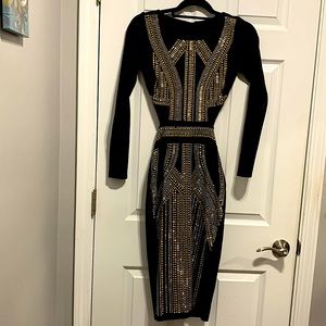 Bebe black dress with silver and gold metallic appliqués.